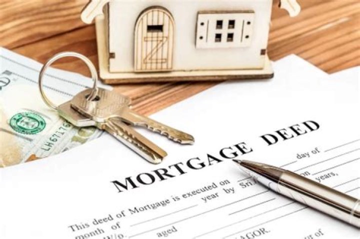 Can one spouse be on the mortgage but both on the title?