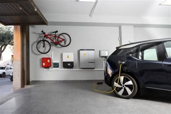Can you plug an electric car into a regular outlet UK?