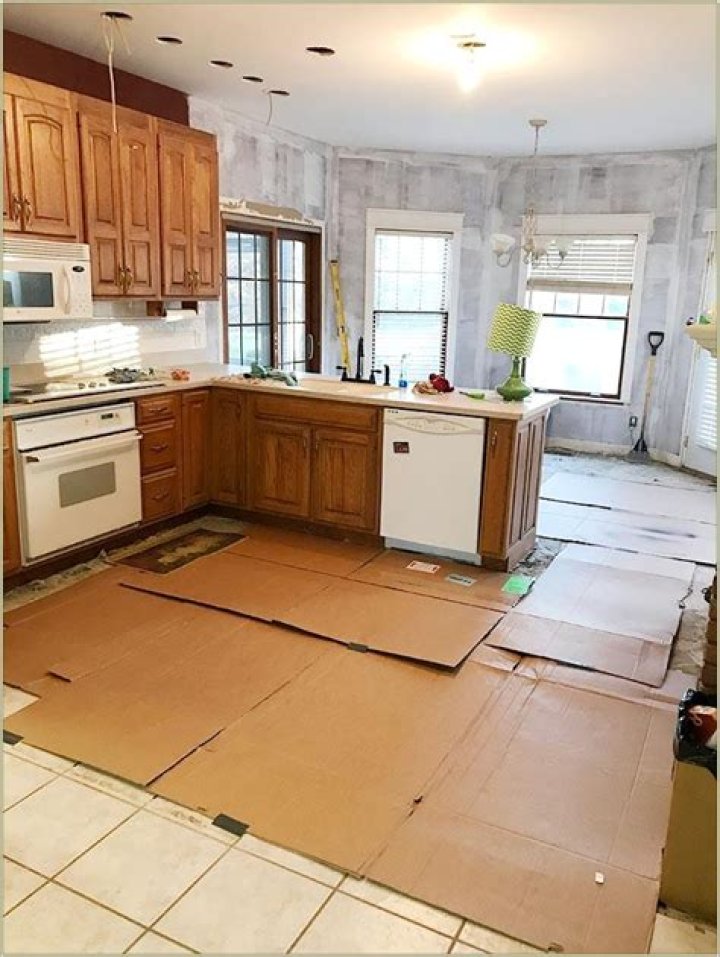 Can you replace kitchen tile without removing cabinets?