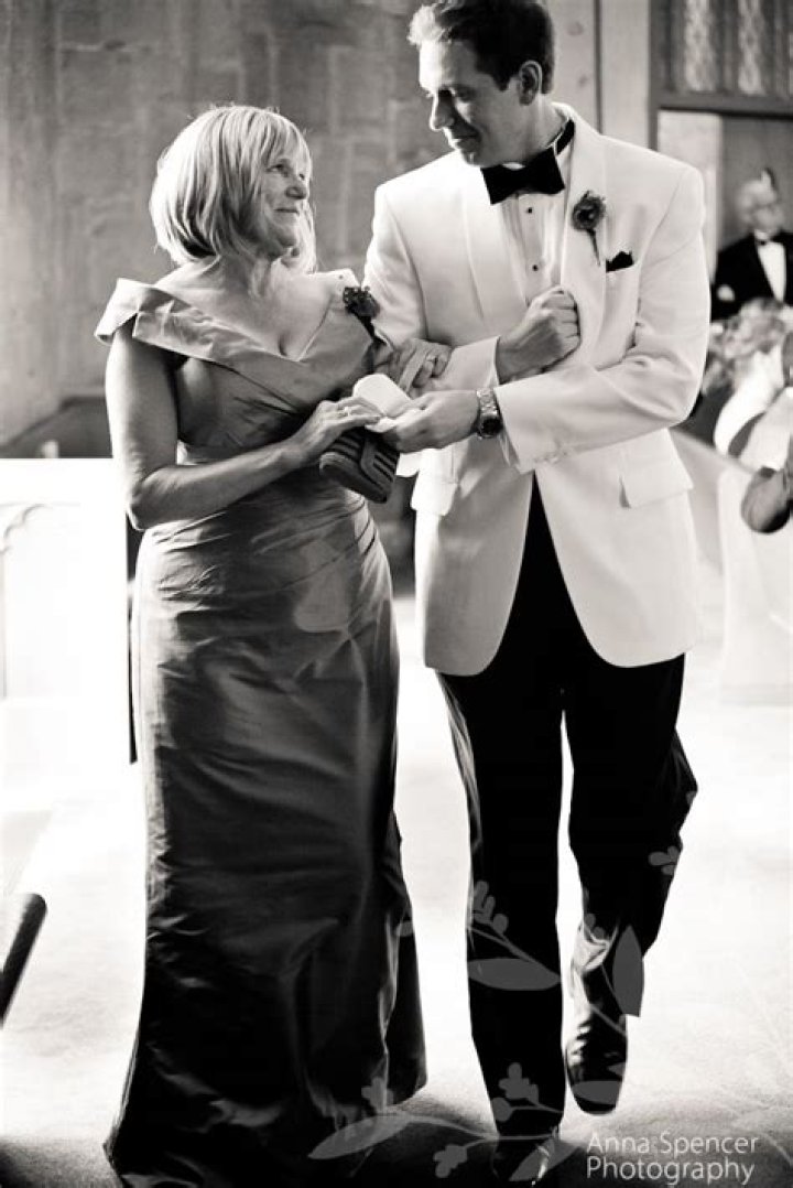 Does the groom walk his mother down the aisle?