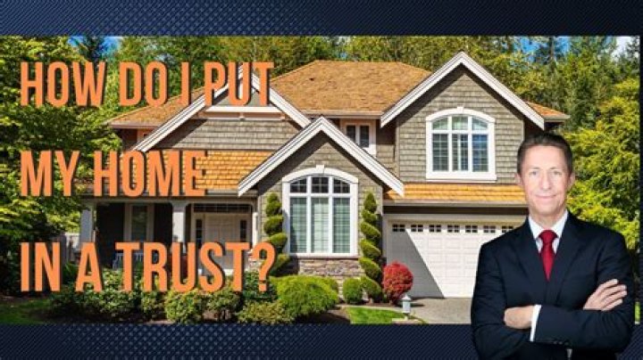 How do I put my house in trust with a mortgage?