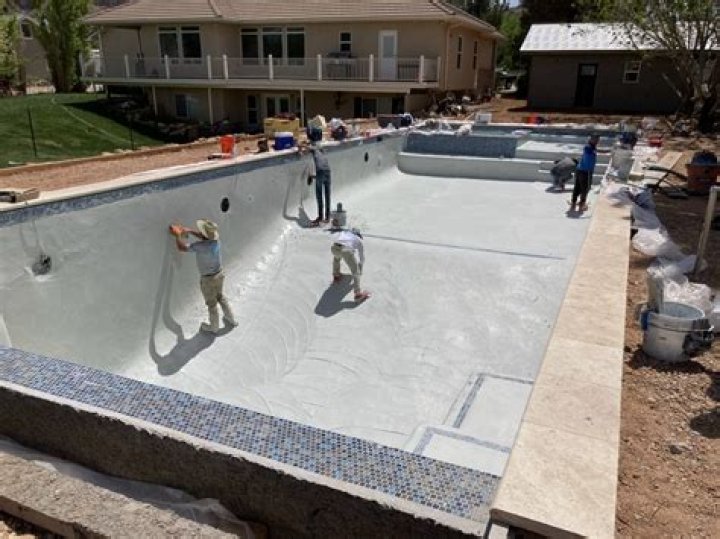 How do you brush a newly plastered pool?