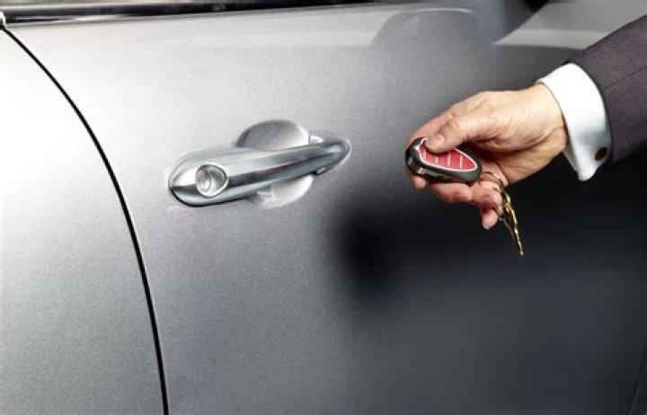 How do you open a locked car with a screwdriver?