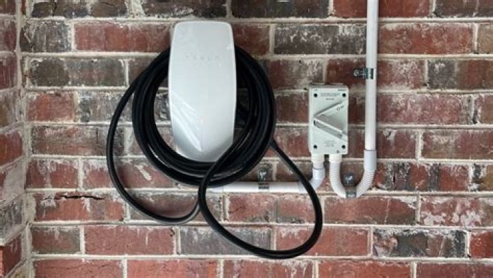 How much does it cost for an electrician to install a Tesla wall charger?