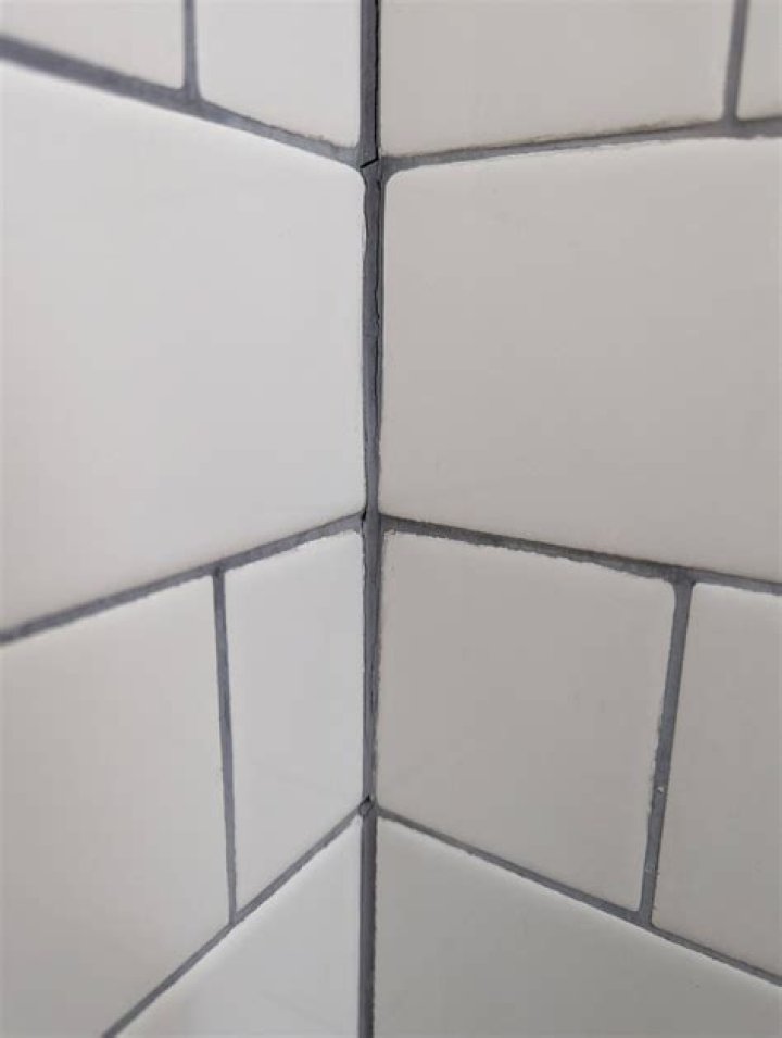 Should you caulk or grout shower corners?