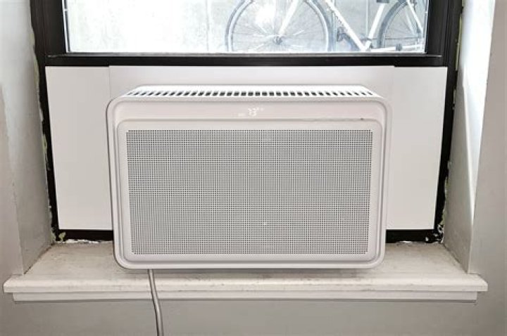 What is the pros and cons of a window air conditioner?