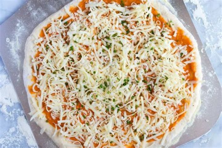 Why does Chicago Pizza have sauce on top?